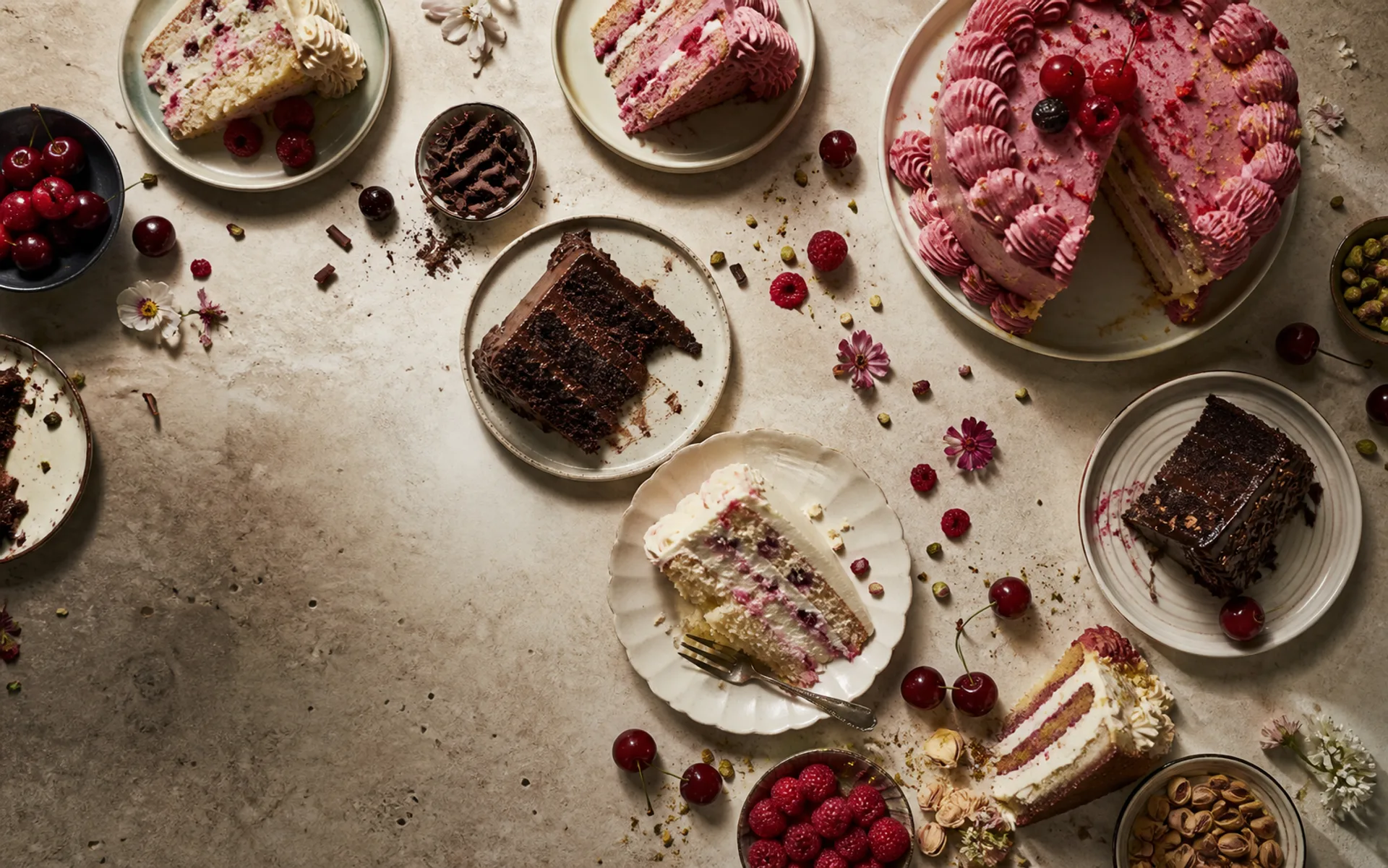 A varied table of cake flavours and celebration styles